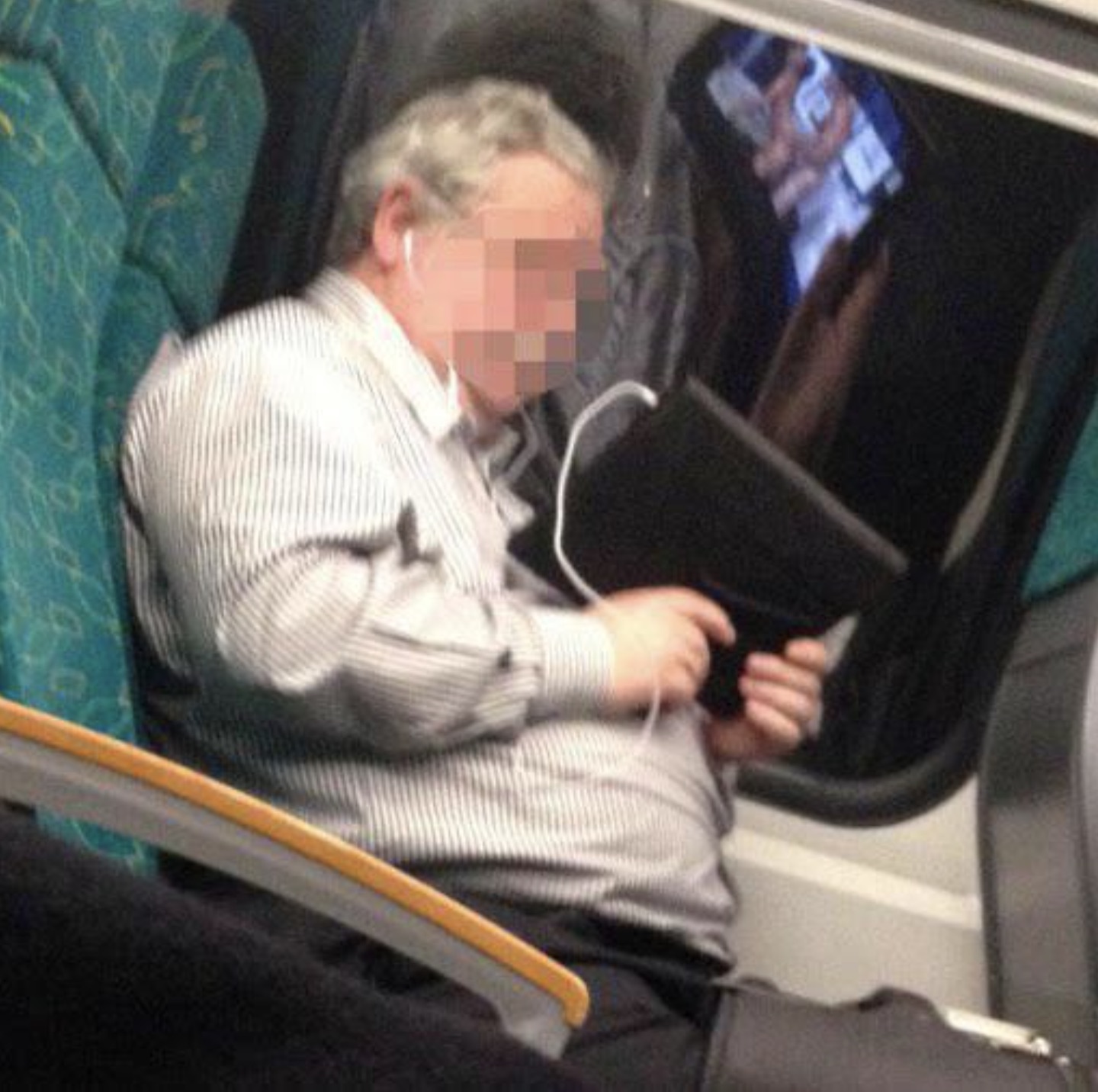 man watching porn on train